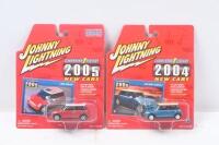 MINIS: Set of 2 1:64 scale Johnny Lightning Lightning Strike 2005 New Cars series new style Minis, 1 Cooper in Red with White roof and US flag on the roof, and 1 Blue and Black 2004 Cooper S, both clear plastic display wrapped.