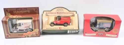 424 · COMMEMORATIVE VANS: Set of 3 1:35-1:50 scale commemorative Vans, 1 Australia Post 1929 Bull Nose Morris, 1 S.P.C. 80th Anniversary Model T Ford, and 1 Haigh's Chocolates Model T Ford, all in custom clear display boxes.