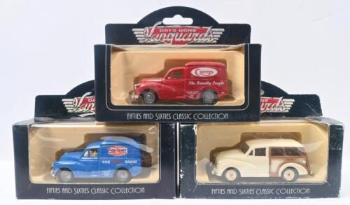 MORRIS MINORS: Set of 3 approx. 1:50 scale Vanguards Days Gone Fifties and Sixties Classic Collection Morris Minors, 1 White Traveller with wood inserts, 1 Red Curry's Van, and 1 Blue Ever Ready Batteries Van, all clear custon display boxed.