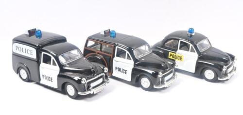 483 · SAICO MORRIS MINOR: Set of 3 1:26 scale Saico Scale Models Series 1956 Morris Minor Police vehicles, all featuring pull back action, all Black with White doors, Police badging and Blue roof mounted Police lights, consisting of 1 Van, 1 Traveller, and 1 Saloon, not boxed..