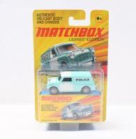 MATCHBOX LESNEY MINI: 1:64 scale Matchbox Lesney Edition Light Teal and White 1965 Austin Mini Police Van, with Police badging, clear display packaged.
