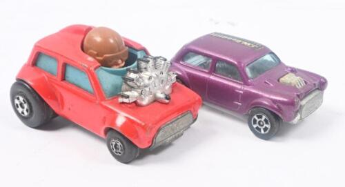 FAST MINIS: 2 fast Minis, 1 1:64 scale Red Matchbox Superfast 1975 Diecast MINI-HA-HA No 14 Mini Cooper Race Car, and 1 1:72 scale Purple Corgi Juniors Whizz Wheels Mini Cooper S, not boxed.