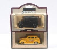 LLEDO DAYS GONE TAXIS: Set of 2 1:64 scale Lledo Days Gone Collection Taxis, 1 1939 Chevrolet Yellow Cab, and 1 Black 1933 Austin, both clear display boxed.