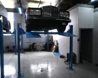 HOIST: A four post 240v hydraulic&nbsp;vehicle hoist 3600kg load capacity, complete with approach ramps and moving dollies. [Location: Mount Waverley] - 9