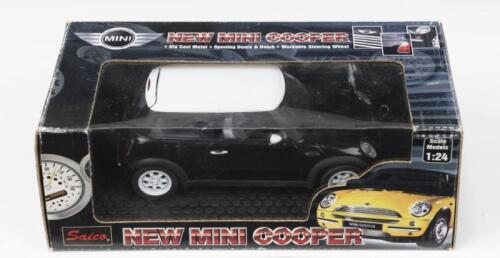 MINI: 1:24 scale Saico Black 2001 "new" Mini Cooper, boxed.