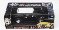 MINI: 1:24 scale Saico Black 2001 "new" Mini Cooper, boxed.
