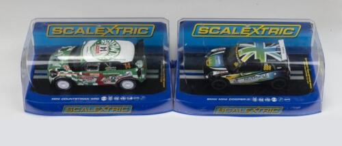 SCALEXTRIC: Set of 2 1:32 Scalextric Minis, 1 Countryman WRC No 14, Rally Monte Carlo 2012, and 1 Mini Cooper S No 888, Mini Challenge 2014, no C of A, clear display boxed.