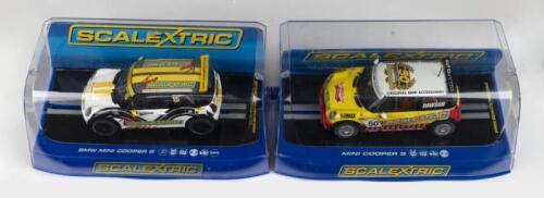 SCALEXTRIC: Set of 2 1:32 Scalextric Minis, 1 Team Scalextric No 15 Mini Cooper S, and 1 Mini Cooper NZ, no C of A, clear display boxed.