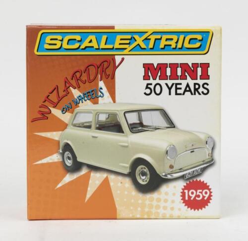 237 · SCALEXTRIC: 1:32 scale Scalextric Wizardry on Wheels White 1959 Morris Mini Minor, Limited Edition No 3730 of 4000, Plaque of Authenticity, clear display case and custom boxed.