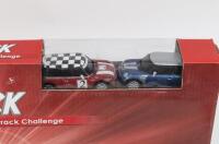 SLOT CAR RACING SET: 1:64 scale JToys racing track set, including tracks, hand throttle controls with connections, crash barriers, and 2 racing Minis, 1 Blue with Silver striping, and 1 Red with White striping and Black and White chequered roof, custom bo - 2