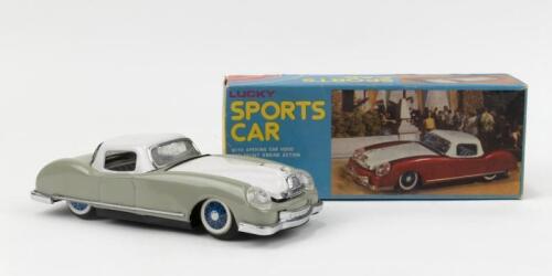 306 · LUCKY TIN: Tin Lucky brand MF 753 friction Sports Car, pale Grey with White roof and bonnet, friction motor makes noise when front wheels turned, custom boxed.