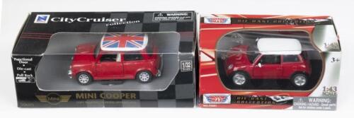 342 · MINI: Set of 2 Mini Coopers, 1 1:43 scale Motormax Die Cast Collection Red and White Mini Cooper, and 1 1:32 scale Red and White New Ray City Cruiser Collection Mini Cooper with Union Jack roof, both custom display boxed.