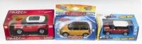 MINI: Set of 3 powered Minis, 1 1:24 scale RMZ City Die Cast Collection Red and White Mini Cooper with lights and sound, 1 1:36 scale Welly Mustard and Black pull back Mini, and 1 1:43 Maisto Fresh Metal Red and White pull back Mini, all custom display bo