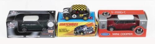 356 · MINIS: Set of 3 Minis, 1 1:60 scale Welly Nex Models Red and White pull back Mini, 1 1:62 scale Maisto Kool Kidz Series Black and White Mini, and 1 1:64 scale Matchbox Lesney Edition 1964 Black, White and Yellow racing Mini #8, all boxed.