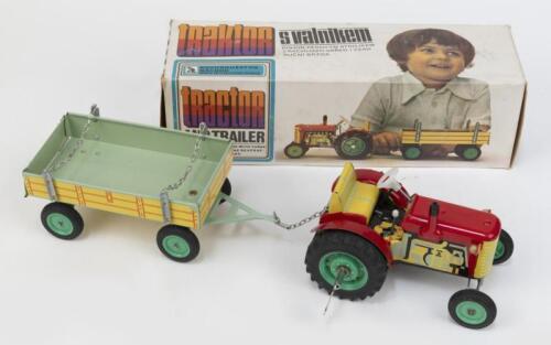 KOVAP: 1:25 scale Kovap Zetor S Valnikem metal and tin tractor and trailer set, clockwork wind up, has gearbox and hand brake, boxed.