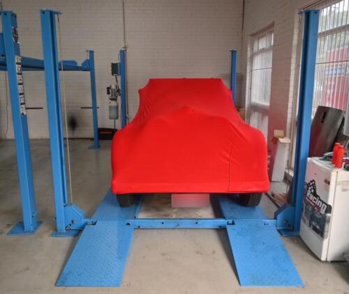 HOIST: A four post 240v hydraulic&nbsp;vehicle hoist 3600kg load capacity, complete with approach ramps and moving dollies. [Location: Mount Waverley]
