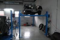 HOIST: A four post 240v hydraulic&nbsp;vehicle hoist 3600kg load capacity, complete with approach ramps and moving dollies. [Location: Mount Waverley] - 9
