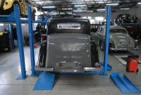HOIST: A four post 240v hydraulic&nbsp;vehicle hoist 3600kg load capacity, complete with approach ramps and moving dollies. [Location: Mount Waverley]