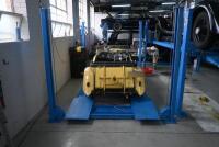 HOIST: A four post 240v hydraulic&nbsp;vehicle hoist 3600kg load capacity, complete with approach ramps and moving dollies. [Location: Mount Waverley]