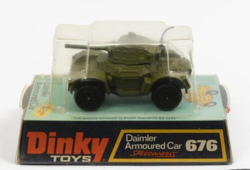 ARMOURED CAR: A Dinky Toys No. 676 Daimler Armoured Car with Speedwheels, within original plastic bubble packaging made in England by Meccano Ltd