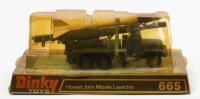 MISSILE LAUNCHER: A Dinky Toys No. 665 Honest John Missile Launcher, complete in original plastic bubble packaging