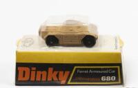 ARMOURED CAR: A Dinky Toys No. 680 Ferret Armoured Car in sand beige with 'Speedwheels' complete in original plastic bubble packaging