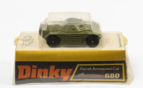 ARMOURED CAR: A Dinky Toys No. 680 Ferret Armoured Car with Speedwheels, in original plastic bubble packaging made in England by Meccano Ltd