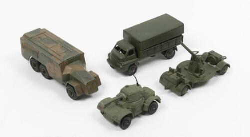 DINKY TOYS: A collection of four Dinky Toys including a 3 Ton Army Wagon, Armoured Command Vehicle, Daimler Armoured Car, 161B Anti-Aircraft Gun on Trailer, made in England by Meccano Ltd
