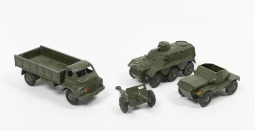 DINKY TOYS: A collection of four Dinky Toys including a 3 Ton Army Truck, Armoured Personnel Carrier, Scout Car and a Military Field Gun, made in England by Meccano Ltd