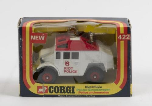 CORGI TOYS RIOT POLICE: A Corgi Toys riot police vehicle, quad tractor, product number 422, packaging has some damage including splits in the clear plastic, made in Hong Kong