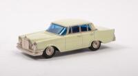 MERCEDES BENZ 220 SEDAN: A Mercedes Benz 220 sedan model car, a cream coloured sedan with blue tinted windows, product number A-2, manufactured by K.K.Sakura - 2