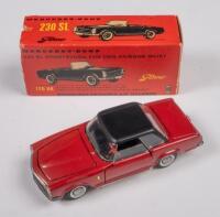 MERCEDES BENZ 230 SL TEKNO MODEL: A Mercedes Benz 230 sl, 170 hp and petrol injection, model has opening doors, boot, bonnet, dark red with a black roof, product number #929, manufactured by tekno