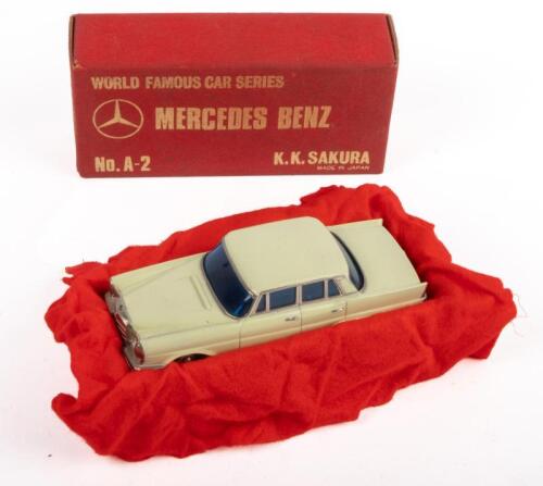 MERCEDES BENZ 220 SEDAN: A Mercedes Benz 220 sedan model car, a cream coloured sedan with blue tinted windows, product number A-2, manufactured by K.K.Sakura