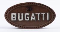 DESK PIECE: A wooden Bugatti 'EB' logo form desk piece or paper weight, 18cm wide.