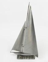 YACHT: A decorative 1950s metal yacht sculpture in full sail on a metal&nbsp;base