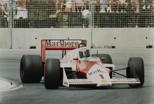 ALAIN PROST: A large photo stock poster depicting Alain Prost driving his McLaren MP4/3, 50cm high, 75cm wide