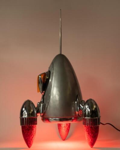 A interesting 'Car Part Art' lamp sculpture in rocket form titled 'Blast Off' by Australian artist Terry Lawrie made from genuine retro car parts including '59 Cadillac taillight lenses and others, approx 66cm high