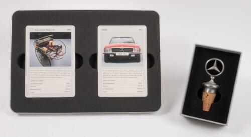 MERCEDES-BENZ: Two official Mercedes-Benz items of memorabilia including wine stopper in form of radiator badge & sealed cards.