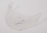 LEWIS HAMILTON: A perspex helmet visor with Lewis Hamilton signature in black marker. Visor 27cm wide.