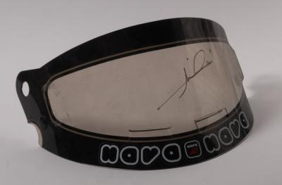 MARIO ANDRETTI: A Formula One helmet visor as signed by Mario Andretti in gold marker.