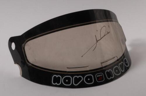 MARIO ANDRETTI: A Formula One helmet visor as signed by Mario Andretti in gold marker.