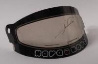 MARIO ANDRETTI: A Formula One helmet visor as signed by Mario Andretti in gold marker.