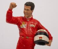 MICHAEL SCHUMACHER: A 1:9 scale limited edition (2435/5000) cold cast porcelain resin figure of Michael Schumacher sculpted by Paul Szeiler for Endurance Ltd, on wooden base with engraved plaque, NIB and accompanied by a COA from The Art of Sport, 22cm hi - 2