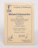 MICHAEL SCHUMACHER: A 1:9 scale limited edition (2435/5000) cold cast porcelain resin figure of Michael Schumacher sculpted by Paul Szeiler for Endurance Ltd, on wooden base with engraved plaque, NIB and accompanied by a COA from The Art of Sport, 22cm hi - 4