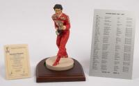 AYRTON SENNA: A 1:9 scale limited edition&nbsp;cold cast porcelain resin figure of Ayrton Senna sculpted by Paul Szeiler for Endurance Ltd, on wooden base with engraved plaque, NIB and accompanied by a COA from The Art of Sport, 22cm high