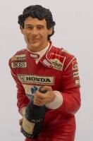 AYRTON SENNA: A 1:9 scale limited edition&nbsp;cold cast porcelain resin figure of Ayrton Senna sculpted by Paul Szeiler for Endurance Ltd, on wooden base with engraved plaque, NIB and accompanied by a COA from The Art of Sport, 22cm high - 2