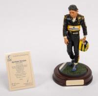AYRTON SENNA: A 1:9 scale limited edition (3950/5000) cold cast porcelain resin figure of Ayrton Senna sculpted by Paul Szeiler for Endurance Ltd, on wooden base with engraved plaque, NIB and accompanied by a COA from The Art of Sport, 22cm high