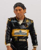 AYRTON SENNA: A 1:9 scale limited edition (3950/5000) cold cast porcelain resin figure of Ayrton Senna sculpted by Paul Szeiler for Endurance Ltd, on wooden base with engraved plaque, NIB and accompanied by a COA from The Art of Sport, 22cm high - 2