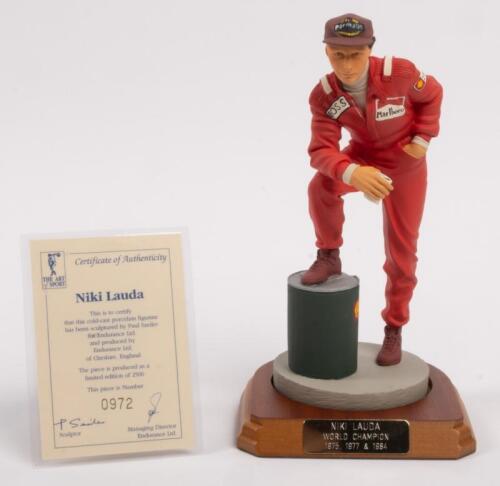 NIKI LAUDA: A 1:9 scale limited edition (0972/5000) cold cast porcelain resin figure of Niki Lauda sculpted by Paul Szeiler for Endurance Ltd, on wooden base with engraved plaque, NIB and accompanied by a COA from The Art of Sport, 22cm high
