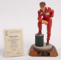 NIKI LAUDA: A 1:9 scale limited edition (0972/5000) cold cast porcelain resin figure of Niki Lauda&nbsp;sculpted by Paul Szeiler for Endurance Ltd, on wooden base with engraved plaque, NIB and accompanied by a COA from The Art of Sport, 22cm high
